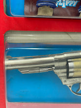 Load image into Gallery viewer, Detail view of the silver and blue toy gun with accessories.
