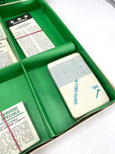 Load image into Gallery viewer, 1967 scoop! board game cards in a green tray showing text on cards.
