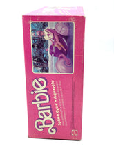 Carica l'immagine nel visualizzatore di Gallery, Side view of the Mattel Barbie doll box in pink and purple with an image of the doll.
