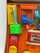 Load image into Gallery viewer, Detail view of colorful toy parts from Tomy Jouets Mont Blanc Multi mobile with various shapes.

