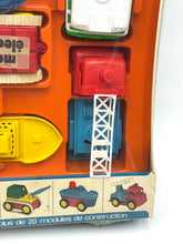 Load image into Gallery viewer, Detail view of colorful toy parts from Tomy Jouets Mont Blanc Multi mobile with various shapes.

