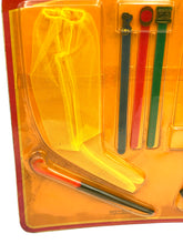 Carica l'immagine nel visualizzatore di Gallery, Detail shot of colorful play accessories in yellow, red, and green.
