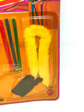 Carica l'immagine nel visualizzatore di Gallery, Detail of a yellow tool with plastic packaging on a white background.
