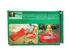Load image into Gallery viewer, Italocremona doll set packaging from a different angle, highlighting an inflatable boat toy.
