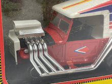 Load image into Gallery viewer, Close-up detail of the Fiat Campagnola Cross showing engine detail and striped design.
