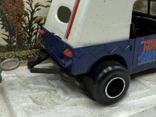 Load image into Gallery viewer, Back view of the blue toy vehicle highlighting rear lights and bumper.
