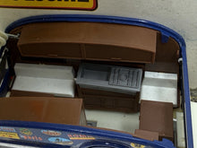 Load image into Gallery viewer, Detail close-up of the toy vehicle interior showing seating area and dashboard.

