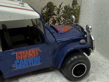Load image into Gallery viewer, Side view of the toy vehicle displaying roof and stripe details.
