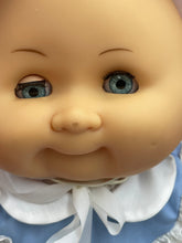 Load image into Gallery viewer, Close-up detail of Gabar Doll 80's Cirilla's face showcasing big eyes and smiling expression.
