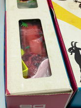 Load image into Gallery viewer, Close-up detail of the 1968 MB board game box with window cutout and colorful design.
