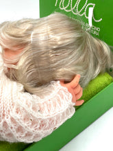 Load image into Gallery viewer, Detail shot of Sebino Nella doll with blonde hair in a knitted sweater and sleeping pose.
