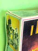 Load image into Gallery viewer, Tyco Racing Warriors box corner detail showcasing character images and curved edge.
