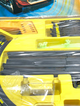 Load image into Gallery viewer, Detail view of Tyco train track components featuring straight track and plastic connectors.
