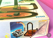 Load image into Gallery viewer, Tyco packaging front view with colorful graphics and track layout details.
