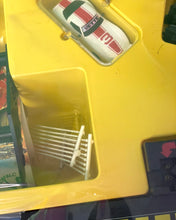 Load image into Gallery viewer, Tyco Daredevil Super Cliff Turbovettes Set close-up of yellow toy compartment with a toy car inside.

