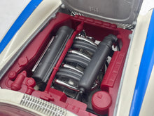 Load image into Gallery viewer, Burago Mercedes 300SL close-up of detailed engine with open hood.

