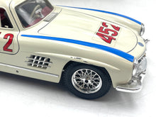 Load image into Gallery viewer, Burago Mercedes 300SL side detail highlighting number 452 and detailed wheels.
