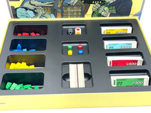 Load image into Gallery viewer, Detail shot of Ravensburger Vintage Board Game Shark components including colorful tokens and game cards.

