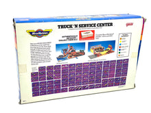 Load image into Gallery viewer, Galoob Micro Machines Truck 'N Service Centre back view displaying product details and color chart.
