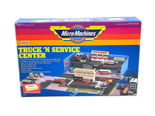 Load image into Gallery viewer, Galoob Micro Machines Truck 'N Service Centre packaging front view with colorful graphics.
