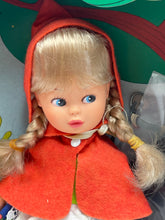 Carica l'immagine nel visualizzatore di Gallery, Effe Bambole Franca close-up of the doll face showcasing braided hair, red hood, and blue eyes.
