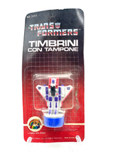 Carica l'immagine nel visualizzatore di Gallery, Front view of the 1984 Transformers Official Stamp Starscream in cardboard packaging.
