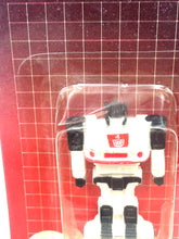 Carica l'immagine nel visualizzatore di Gallery, Detail close-up of the 1984 Transformers Jazz robot figure against a grid pattern background.

