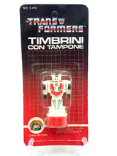 Carica l'immagine nel visualizzatore di Gallery, Front view of the Transformers toy packaging featuring graphic design and colors.
