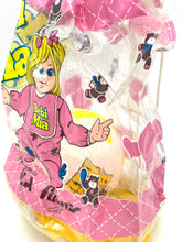 Carica l'immagine nel visualizzatore di Gallery, Close-up detail of the colorful candy bag with cartoon character and transparent packaging.
