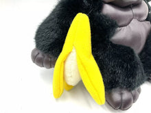 Load image into Gallery viewer, Detail view of Dan Dee Black Ape Gorilla plush with banana accessory and tag.

