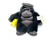 Load image into Gallery viewer, Dan Dee Black Ape Gorilla plush front view with yellow banana accessory.
