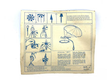 Load image into Gallery viewer, Instruction manual with illustrations and text instructions in beige and blue.
