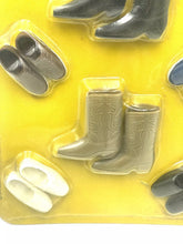 Carica l'immagine nel visualizzatore di Gallery, Mattel Barbie Friends Ken Brad Shoes set close-up of miniature boots showcasing various colors.
