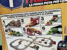 Load image into Gallery viewer, Close-up of Tyco US1 Motorcity Set box artwork and contents


