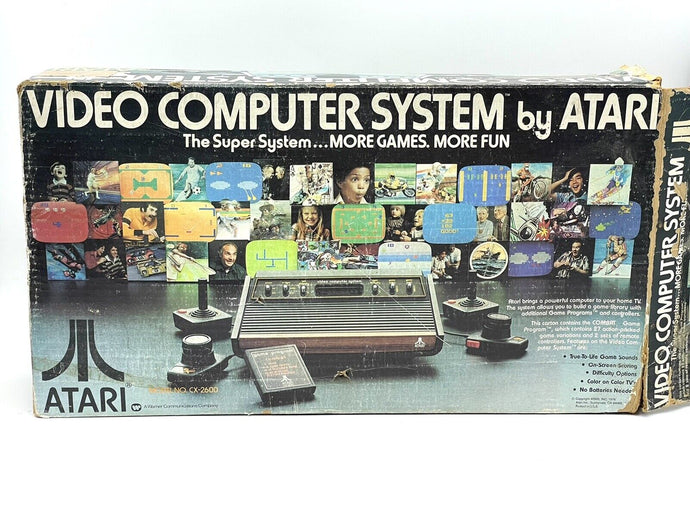Front view of Atari VCS 2600 Woody console with original box

