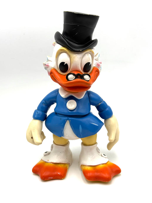 Front view of vintage LEDRA Uncle Scrooge rubber figure, missing cane