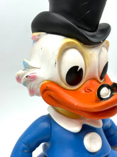 Load image into Gallery viewer, Side profile of vintage LEDRA Plastic Uncle Scrooge toy with age wear
