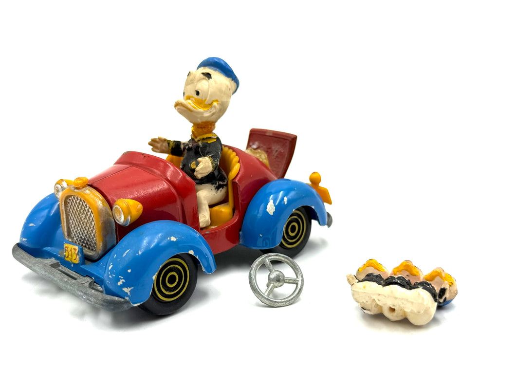 Front view of Politoys M554 Donald Duck Car vintage die-cast with Huey Dewey and Louie